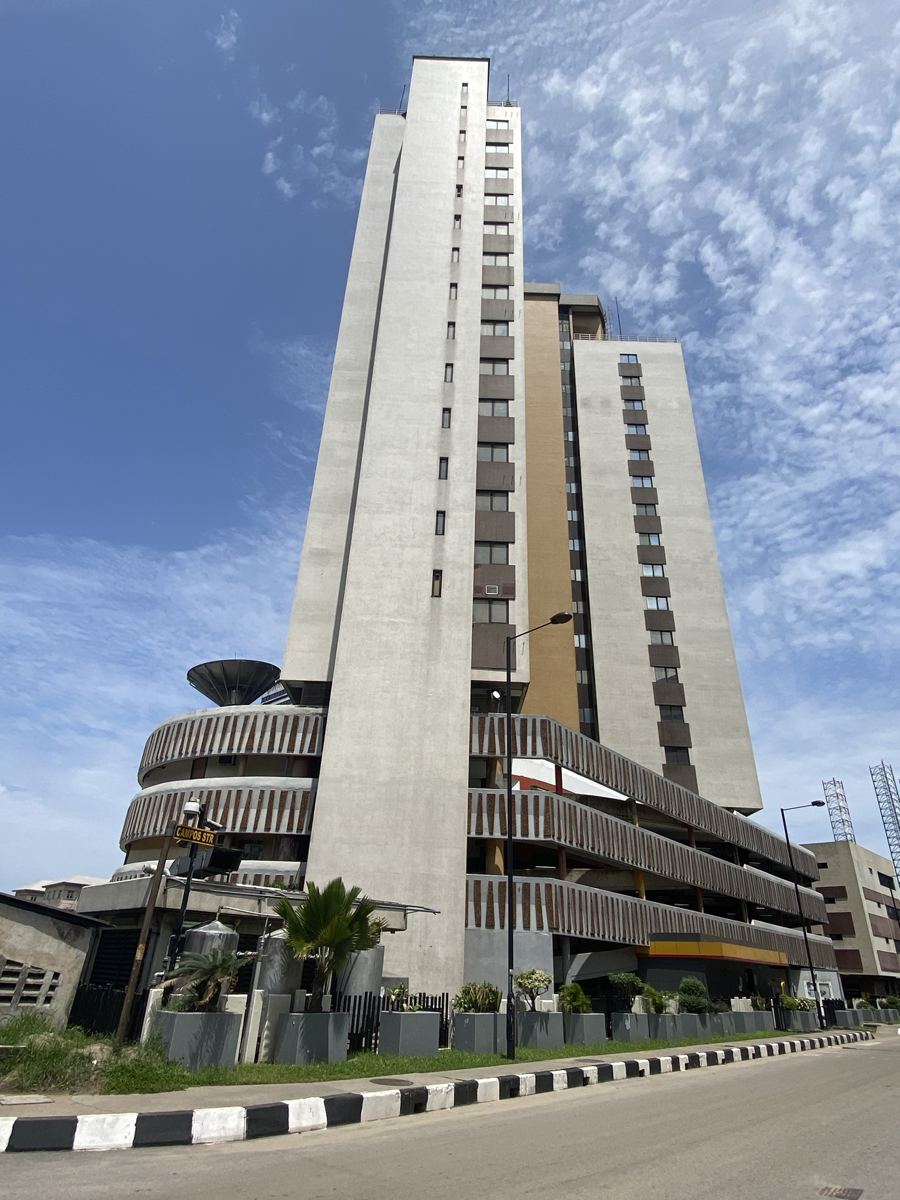 Low-angle shot of a tall office tower on Campos Street, Lagos Island